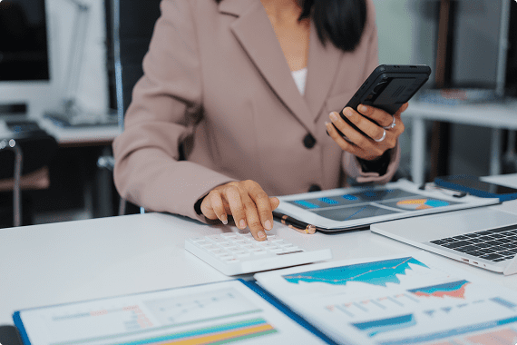 Woman analyzing financial data at desk