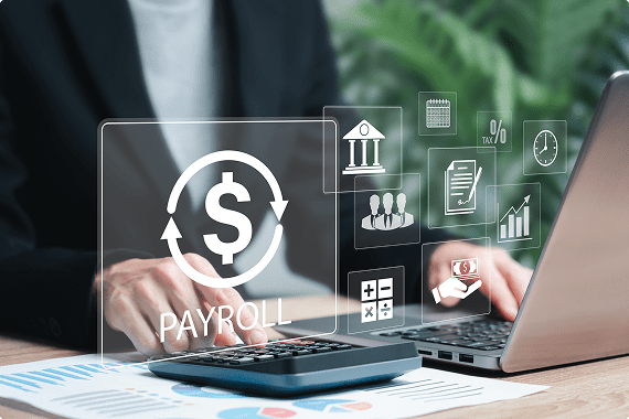 Payroll processing with laptop and calculator