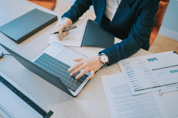 Professional reviewing charts and graphs